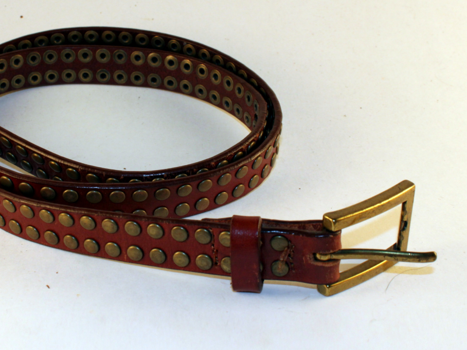 Thin, brown leather belt with rivets